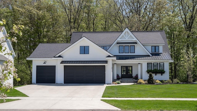 8182 Country Rail Dr SW, Byron Center, MI 49315 - modern inspired farmhouse with french doors, a standing seam roof, concrete driveway, a front lawn, and roof with shingles