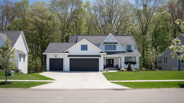 8182 Country Rail Dr SW, Byron Center, MI 49315 - modern farmhouse featuring a standing seam roof, driveway, a front yard, and a garage