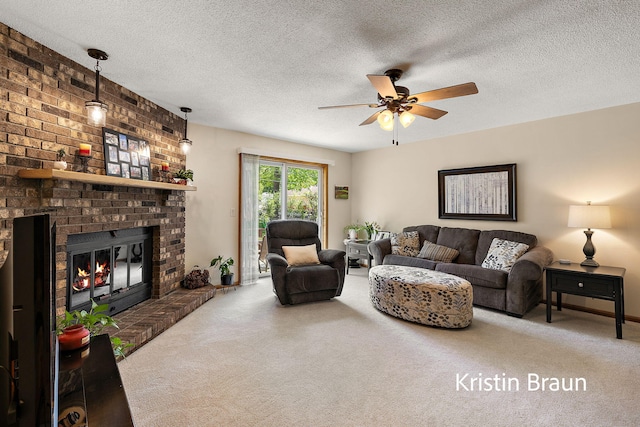 carpeted living area with a ceiling fan, a fireplace, and a textured ceiling