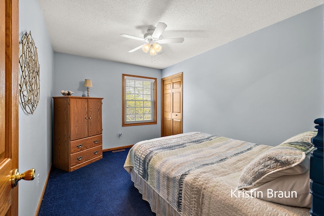 bedroom with carpet, a textured ceiling, a closet, baseboards, and ceiling fan