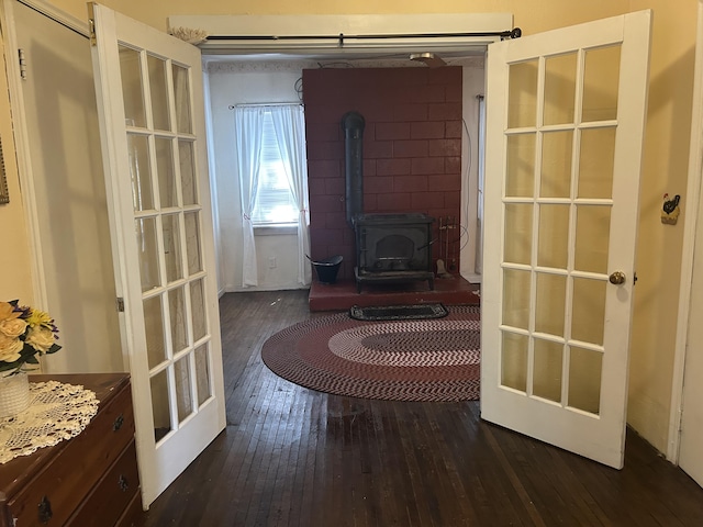 1902 W Ogilvie Ave, Baldwin, MI 49304 - living area with a wood stove, dark wood-style floors, and french doors