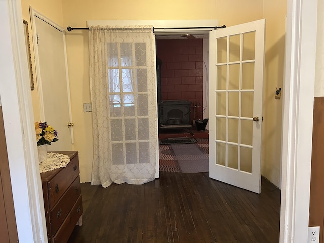1902 W Ogilvie Ave, Baldwin, MI 49304 - bathroom with hardwood / wood-style floors, a wood stove, a shower with shower curtain, and vanity