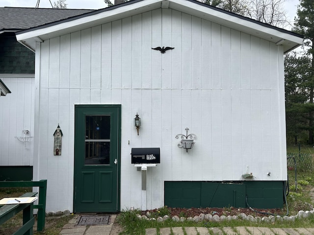 1902 W Ogilvie Ave, Baldwin, MI 49304 - property entrance with roof with shingles