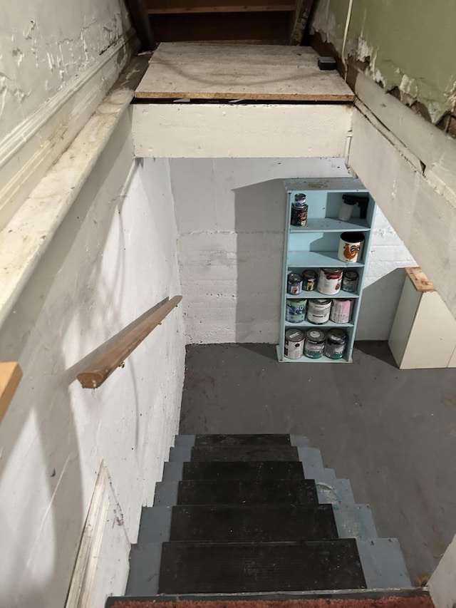 1902 W Ogilvie Ave, Baldwin, MI 49304 - stairway with unfinished concrete flooring
