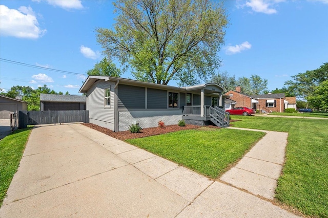 13665 Ida Ave, Warren, MI 48089 - ranch-style house featuring brick siding, concrete driveway, and covered porch