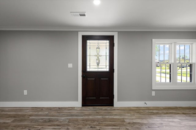 13665 Ida Ave, Warren, MI 48089 - foyer entrance featuring ornamental molding, baseboards, and wood finished floors