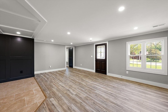 13665 Ida Ave, Warren, MI 48089 - unfurnished living room with crown molding, recessed lighting, baseboards, and light wood finished floors