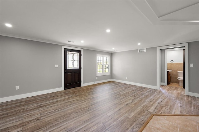13665 Ida Ave, Warren, MI 48089 - foyer featuring wood finished floors, recessed lighting, baseboards, and ornamental molding