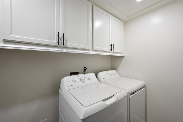 13665 Ida Ave, Warren, MI 48089 - clothes washing area featuring cabinet space and independent washer and dryer