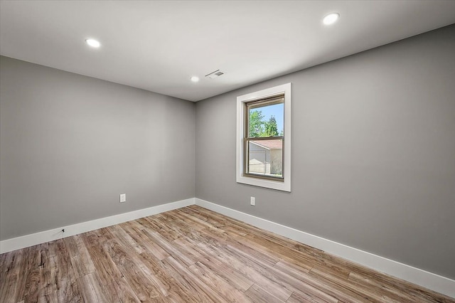 13665 Ida Ave, Warren, MI 48089 - empty room with light wood-type flooring, baseboards, and recessed lighting
