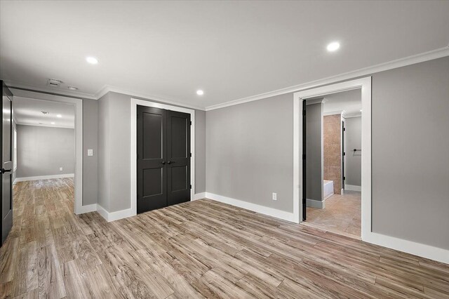 13665 Ida Ave, Warren, MI 48089 - unfurnished bedroom with light wood-type flooring, ornamental molding, recessed lighting, baseboards, and a closet