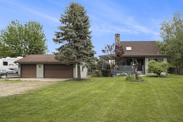 6528 Douglas Ave, Kalamazoo, MI 49009 - view of front of home featuring a chimney, a front yard, a detached garage, an outbuilding, and a shingled roof