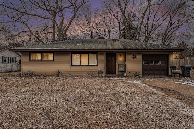 1772 Lombard St, Benton Harbor, MI 49022 - ranch-style house with an attached garage, fence, and a chimney