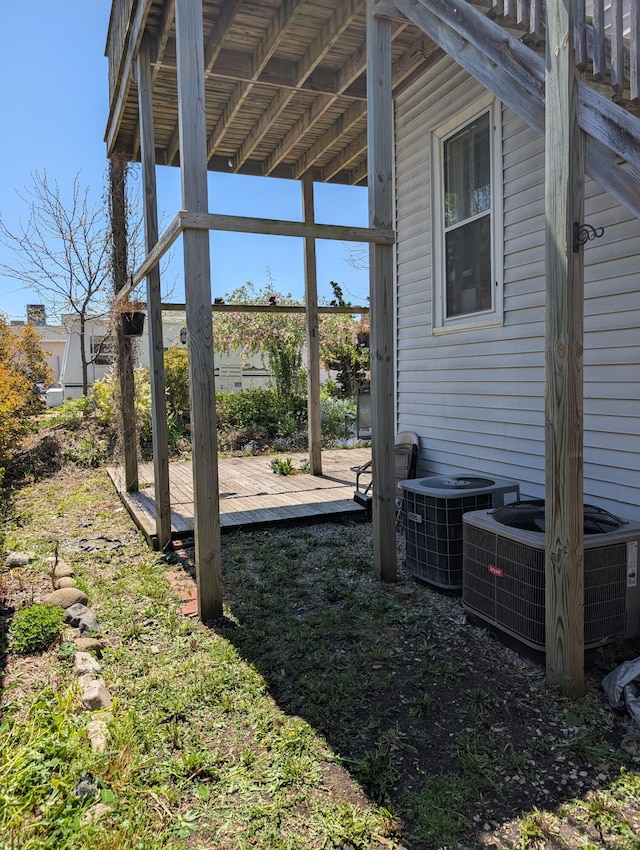 120 N Main St, Scottville, MI 49454 - view of yard with central air condition unit and a wooden deck
