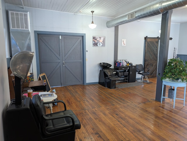 120 N Main St, Scottville, MI 49454 - office area featuring a barn door and hardwood / wood-style floors