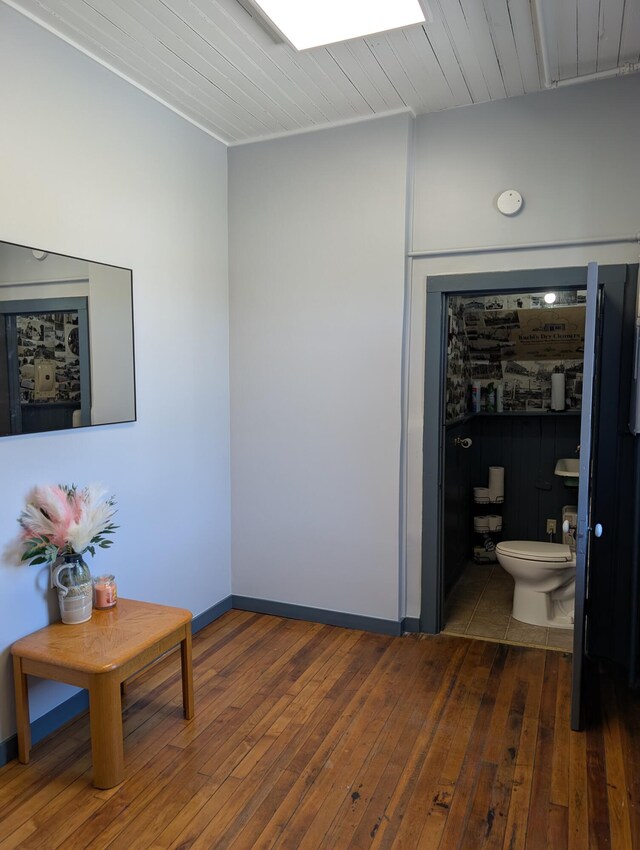 120 N Main St, Scottville, MI 49454 - hall with wood-type flooring and baseboards