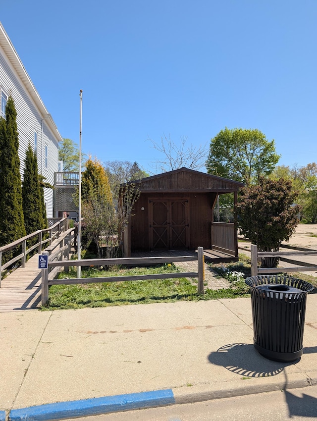 120 N Main St, Scottville, MI 49454 - view of community featuring a storage unit and an outdoor structure