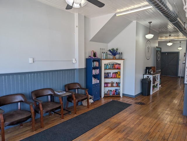 120 N Main St, Scottville, MI 49454 - sitting room with a ceiling fan, hardwood / wood-style flooring, and wainscoting