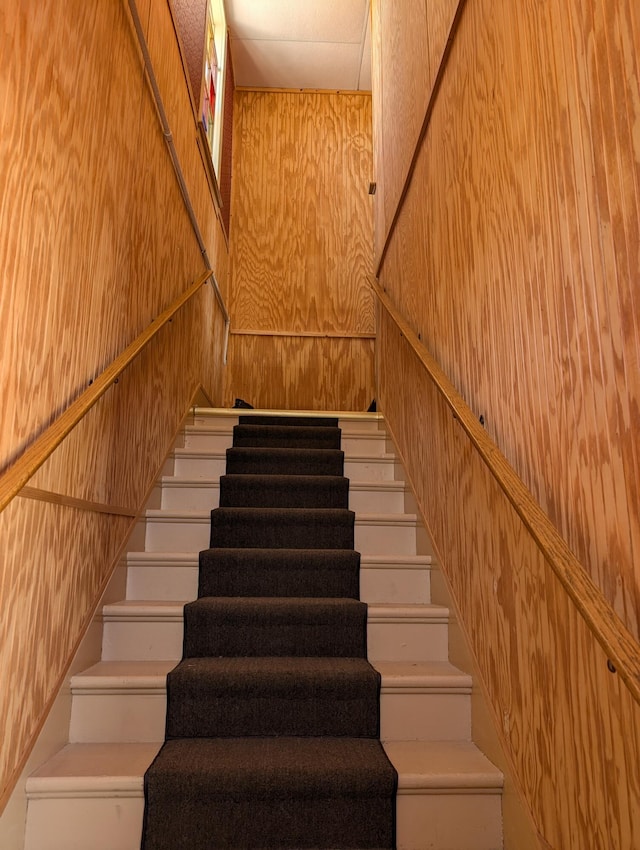 120 N Main St, Scottville, MI 49454 - stairs with wooden walls