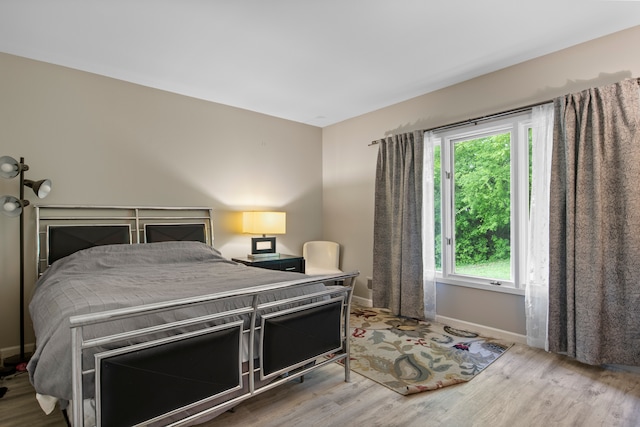 4578 Pine Village Dr, West Bloomfield, MI 48323 - bedroom with wood finished floors and baseboards