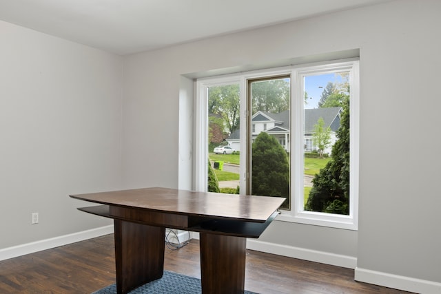 4578 Pine Village Dr, West Bloomfield, MI 48323 - unfurnished dining area with baseboards and dark wood finished floors