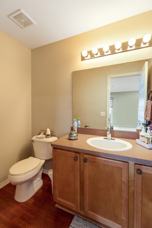 50107 Harding St, Canton, MI 48188 - half bath with wood finished floors, vanity, and toilet