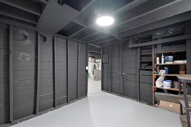 below grade area featuring heating unit