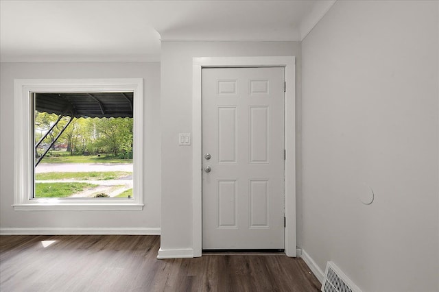 foyer entrance featuring dark wood-style flooring and baseboards