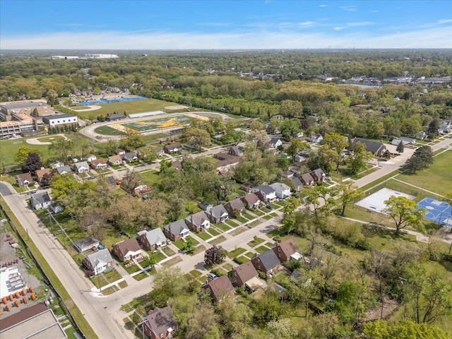 aerial view of property's location with nearby suburban area
