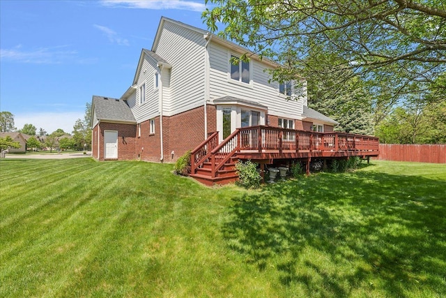 19880 Irving Dr, Livonia, MI 48152 - back of property with brick siding and a wooden deck