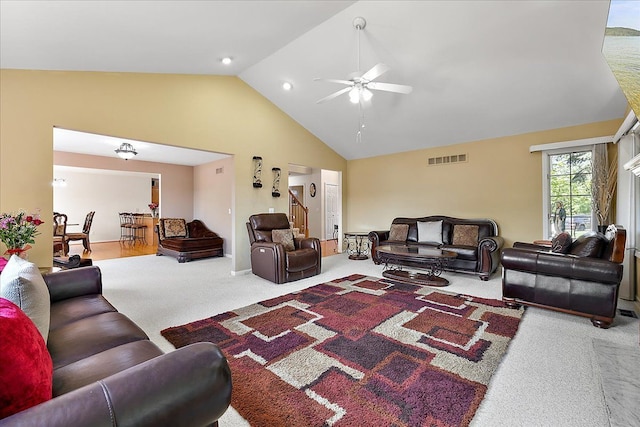 19880 Irving Dr, Livonia, MI 48152 - living room with carpet floors, a ceiling fan, stairway, and high vaulted ceiling