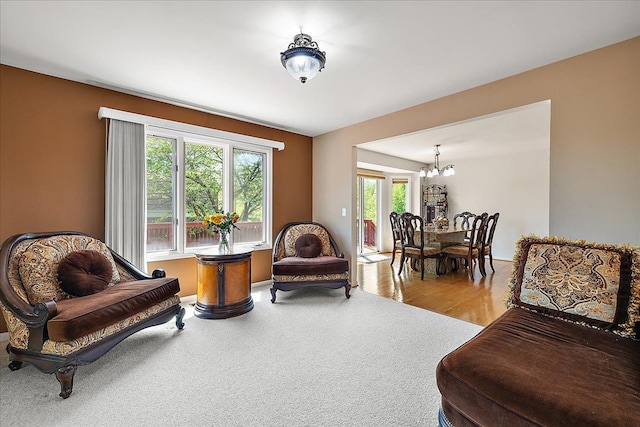 19880 Irving Dr, Livonia, MI 48152 - living area featuring a chandelier and wood finished floors