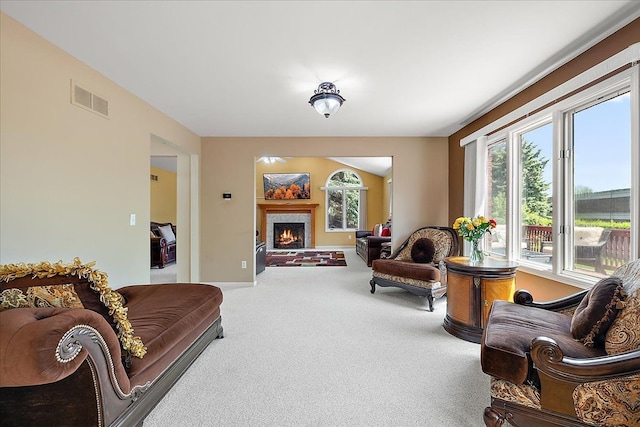 19880 Irving Dr, Livonia, MI 48152 - living area with carpet, a warm lit fireplace, and baseboards