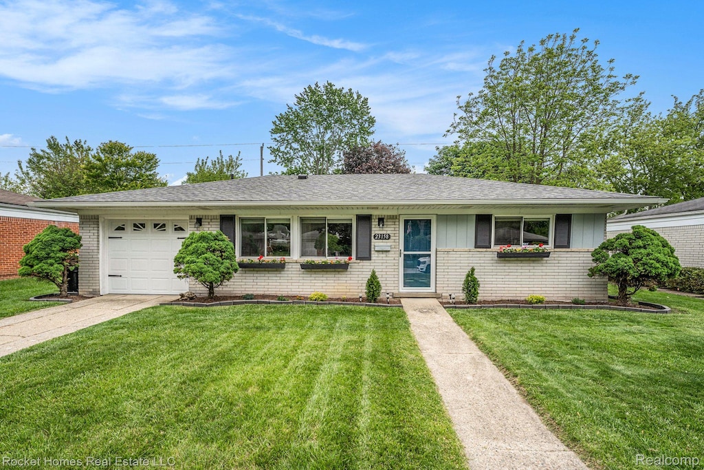 23158 Tuck Rd, Farmington Hills, MI 48336 - ranch-style home with brick siding, an attached garage, concrete driveway, and a front lawn
