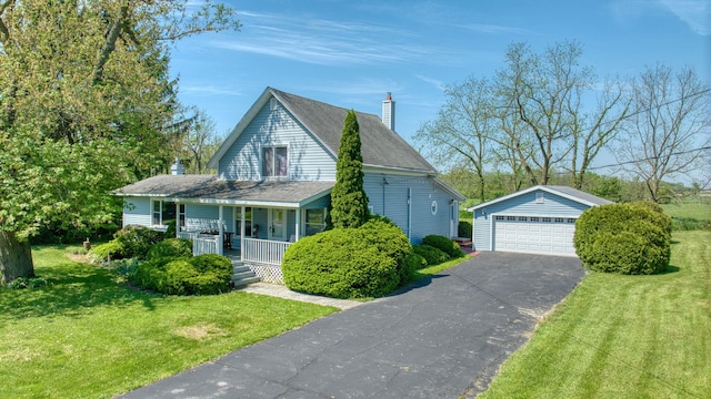 204 Parker St, Cement City, MI 49233 - view of front of property featuring an outbuilding, covered porch, a garage, a chimney, and a front yard