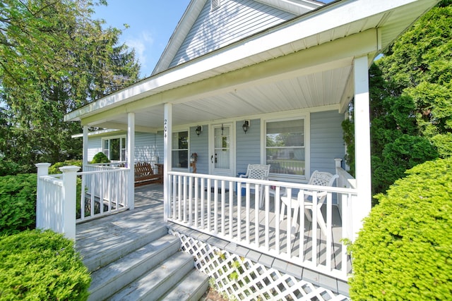204 Parker St, Cement City, MI 49233 - wooden terrace with covered porch