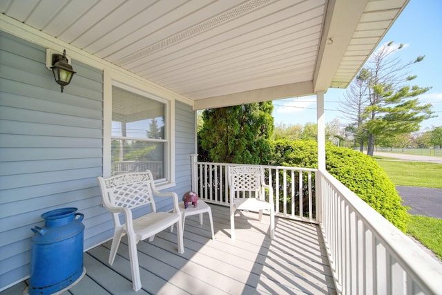 204 Parker St, Cement City, MI 49233 - wooden deck with covered porch
