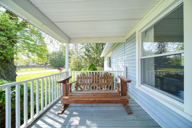 204 Parker St, Cement City, MI 49233 - deck with covered porch and a lawn