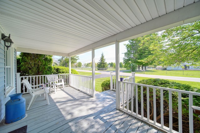 204 Parker St, Cement City, MI 49233 - wooden deck with a porch and a lawn