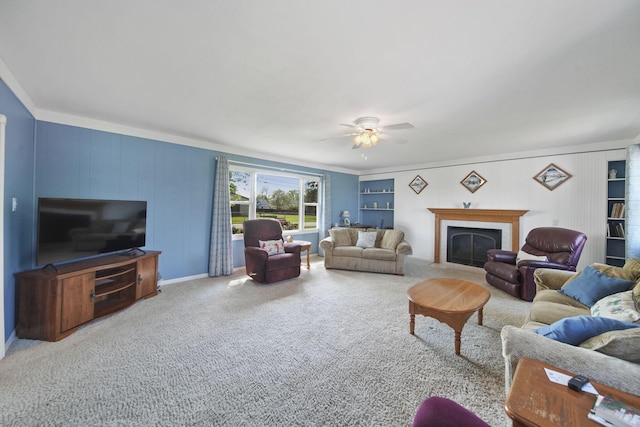 204 Parker St, Cement City, MI 49233 - living room featuring crown molding, a fireplace, ceiling fan, and carpet floors