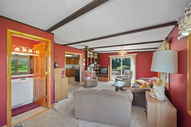 204 Parker St, Cement City, MI 49233 - living area with beam ceiling, carpet floors, and ceiling fan
