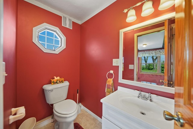 204 Parker St, Cement City, MI 49233 - bathroom with toilet, vanity, baseboards, and ornamental molding