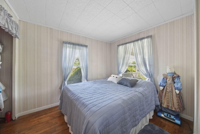 204 Parker St, Cement City, MI 49233 - bedroom featuring multiple windows, hardwood / wood-style flooring, crown molding, and baseboards