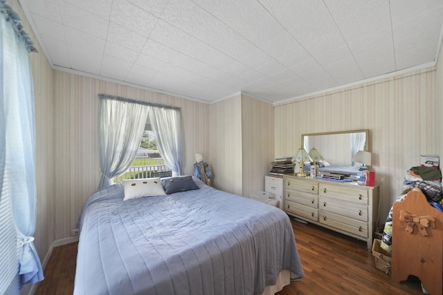 204 Parker St, Cement City, MI 49233 - bedroom with wallpapered walls, crown molding, and dark wood-type flooring