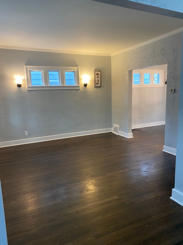 444 E Maplehurst St, Ferndale, MI 48220 - unfurnished room featuring crown molding, dark wood-style flooring, baseboards, and a textured wall
