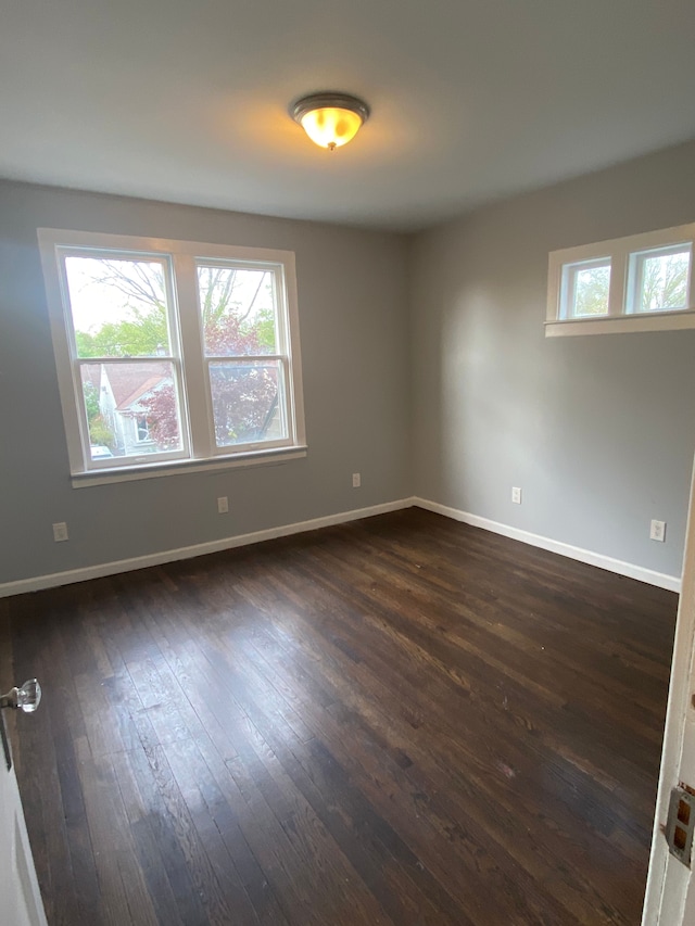 444 E Maplehurst St, Ferndale, MI 48220 - spare room featuring dark wood finished floors and baseboards