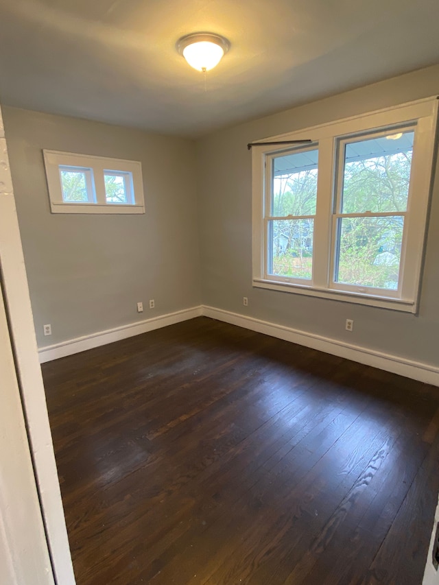 444 E Maplehurst St, Ferndale, MI 48220 - spare room featuring baseboards and dark wood-style flooring