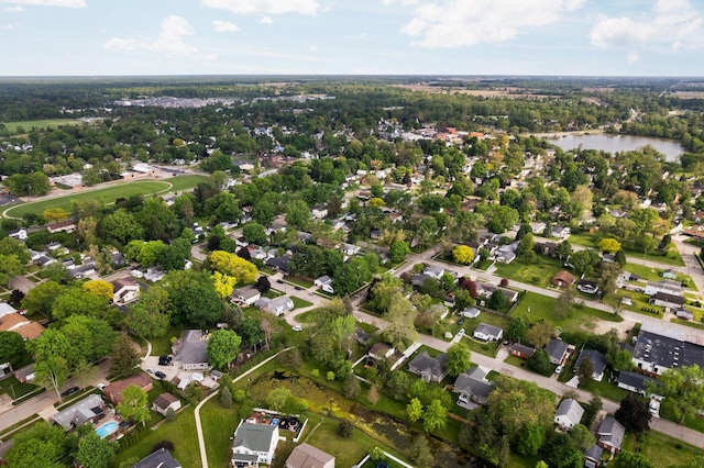 160 Cherry St, Milan, MI 48160 - aerial overview of property's location with a large body of water and nearby suburban area