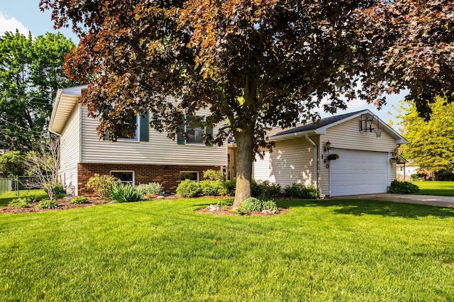 160 Cherry St, Milan, MI 48160 - view of front of house featuring a front yard, driveway, and an attached garage