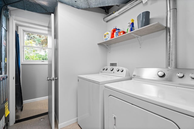 160 Cherry St, Milan, MI 48160 - laundry area featuring washing machine and clothes dryer and baseboards